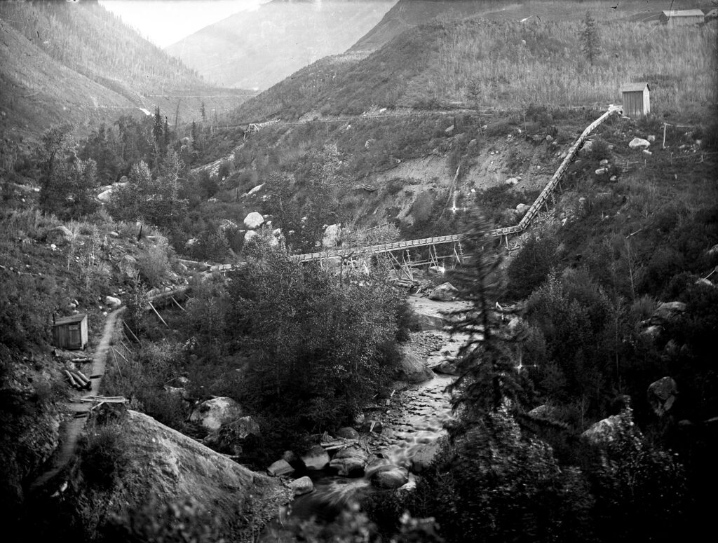 One 6.5" x 8.5" b/w glass plate negative of the lower end of the Castle Creek flume of the Aspen Water System. 1900-