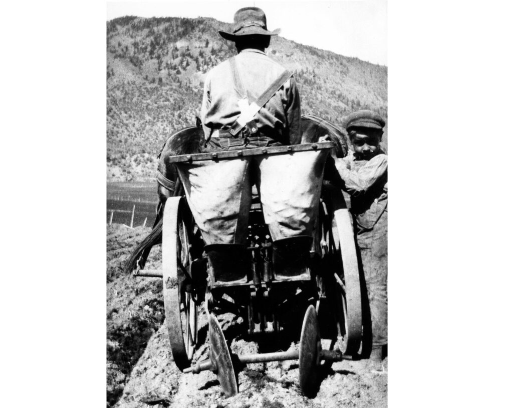 One b/w photograph of a man on a potato planter at the Gerbaz ranch, taken from behind. The man is identified as J.J. Gerbaz, and the young boy on the right is Mike Gerbaz, circa 1915