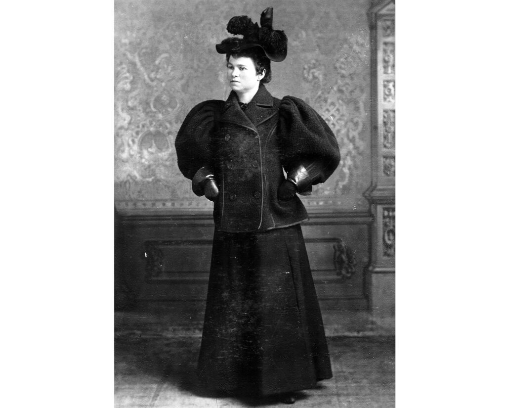 One mounted b/w portrait of a woman in a fancy dress with a large hat, 1895-. She is a member of the Ring family, who were in Aspen in the 1890s.