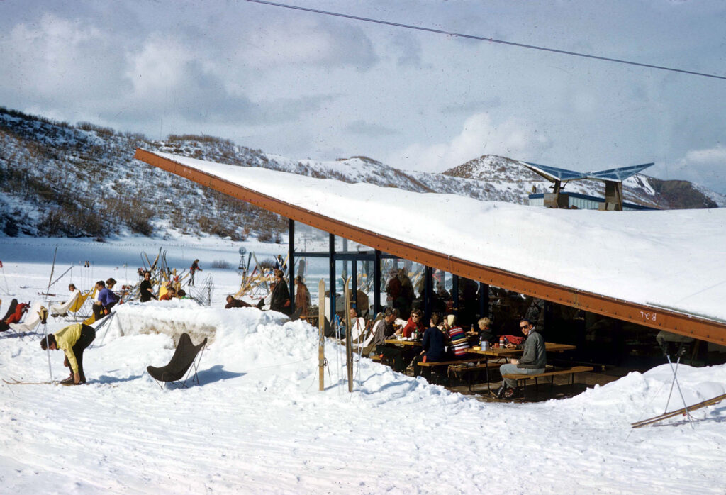 One color slide transparency of the restaurant at the base of Buttermilk, with Pyramid Peak from a distance, January 1959. The base lodge was designed by Aspen architect, Jack Walls, in 1958.