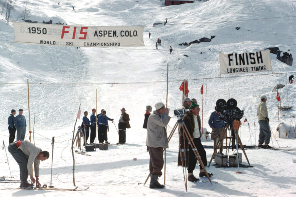 One digital image of a color slide showing the finish line of the 1950 FIS World Championships ski race courses. There are several television cameras.