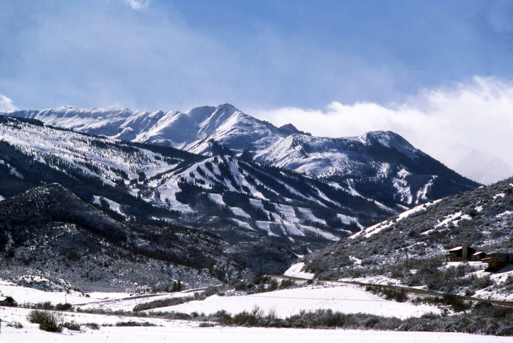 One color slide of Brush Creek Road and Snowmass Ski Area in the distance, 1977.