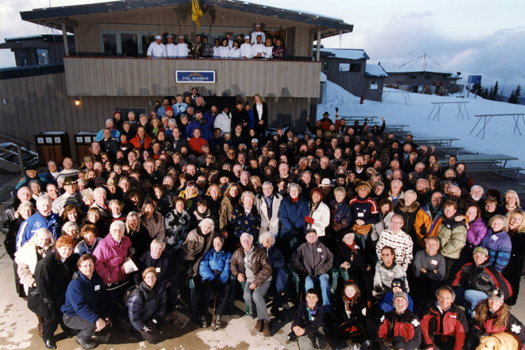 One 8" x 10" color photograph of the Sundeck Reunion party taken in April 1999 before the building was demolished. There is a large group of people in front of the east entrance to the Sundeck including Linda Vitti Herbst, Tom Anderson, Dick Durrance, Margaret Durrance, Ned Ryerson, Phoebe Ryerson, Loren Ryerson, Ed Pfab, Jim Hearn, Patty Edmondson, Willard Clapper, Anne Clapper, Gretl Uhl, Christine Aubale-Gerschel, Peggy Rowland, Howard Awrey, Peter Birrfelder, Mary Eshbaugh Hayes, Bob Throm, Phyllis Throm, Rob Baxter (Aspen Mtn. Manager), Ruth Whyte, Charlie Paterson and many others.